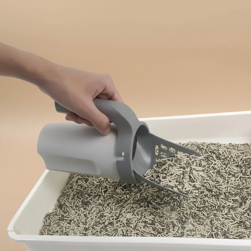 Grey plastic cat litter scoop with ergonomic handle