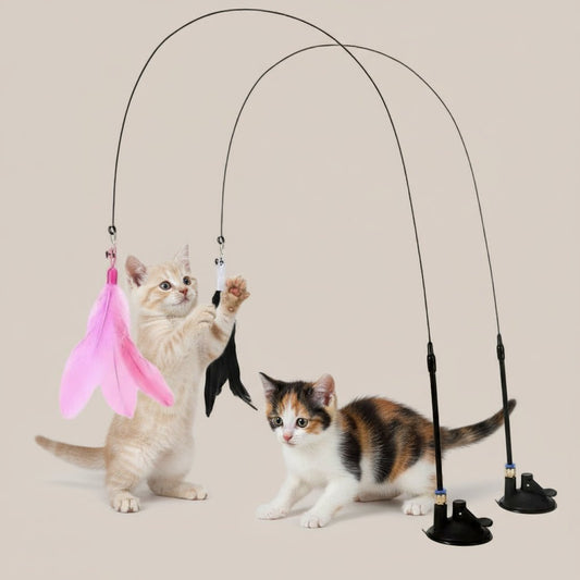 Cat toy with pink and black feathers on a gray background